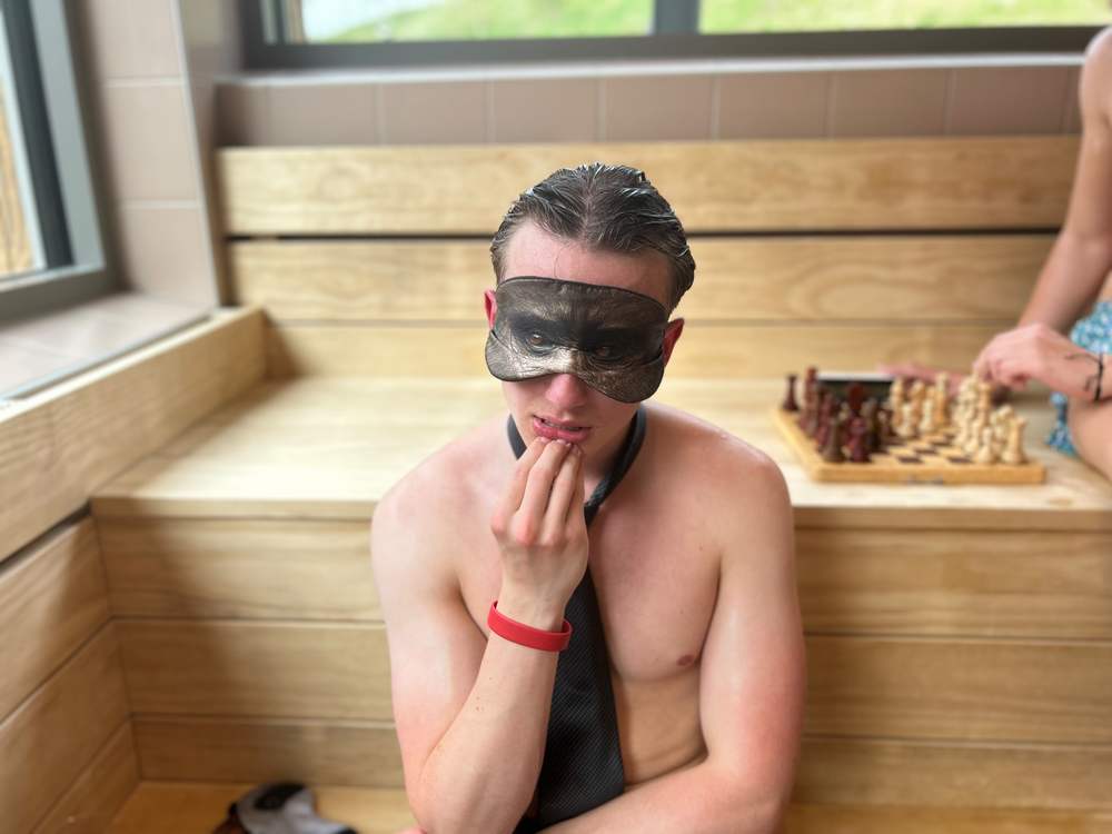 A concentrated player in mask and tie